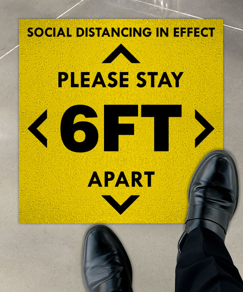 Social Distancing in Effect Floor Sign